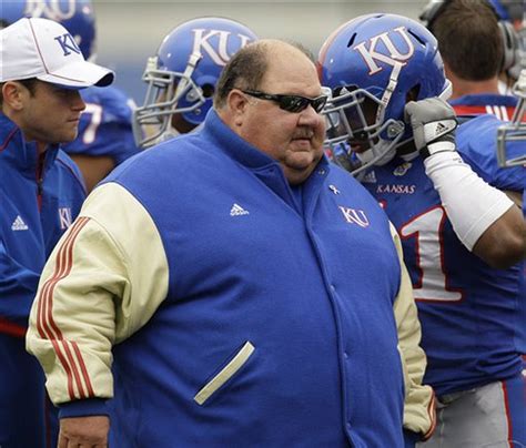 Fat kansas coach - Thursday, November 18, 1999 -- Jayhawks player suspended over chalupa. Associated Press. LAWRENCE, Kan. -- A 270-pound University of Kansas football player got stuck in the drive-thru window of a Taco Bell when he tried to charge employees who left the chalupa out of his order, authorities said.